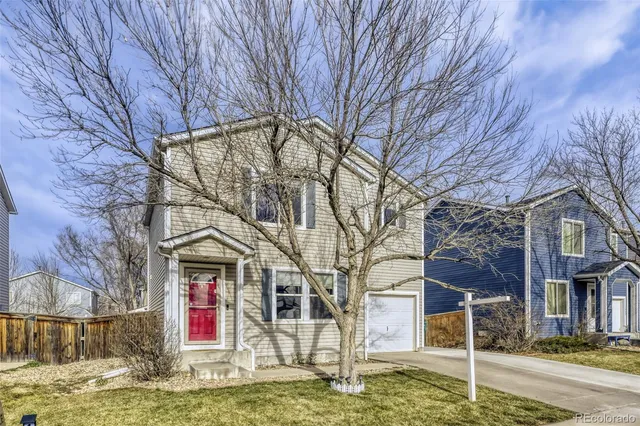 a house with trees in front of it