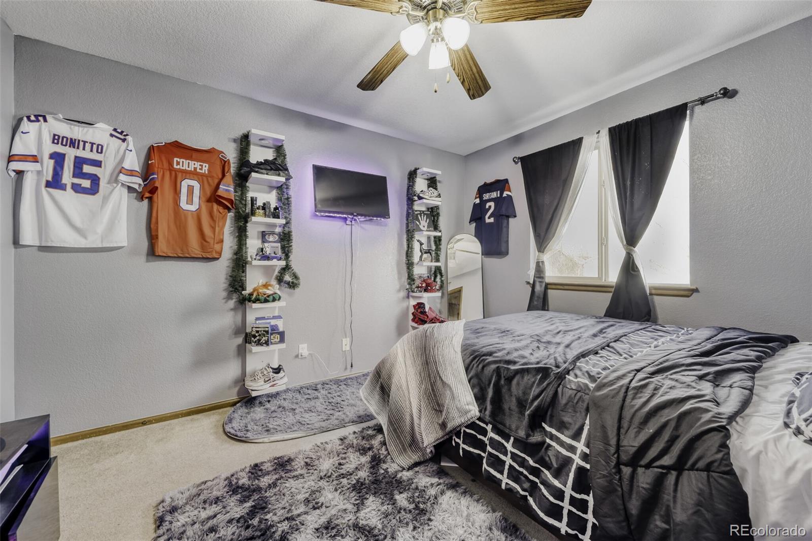 1435 Hummingbird Circle Brighton, CO 80601 - Photo 16 of 22 a bedroom with a bed and a walk in closet