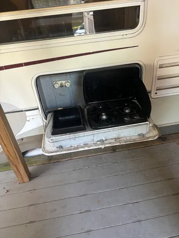 a view of living room and dining room with furniture wooden floor and a fireplace