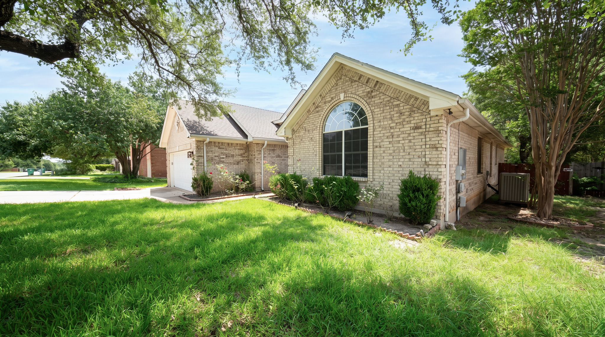 1108 Antelope Ridge Cedar Park, TX 78613 - Photo 20 of 27 Well-maintained brick residence featuring a classic arched window and an attached garage.
