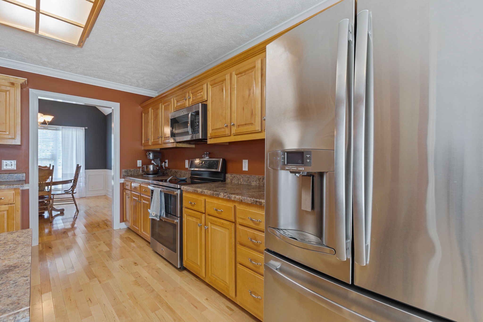 1972 Espy Road Bradyville, TN 37026 - Photo 12 of 67 a kitchen with stainless steel appliances granite countertop a refrigerator a stove and a sink with wooden floor