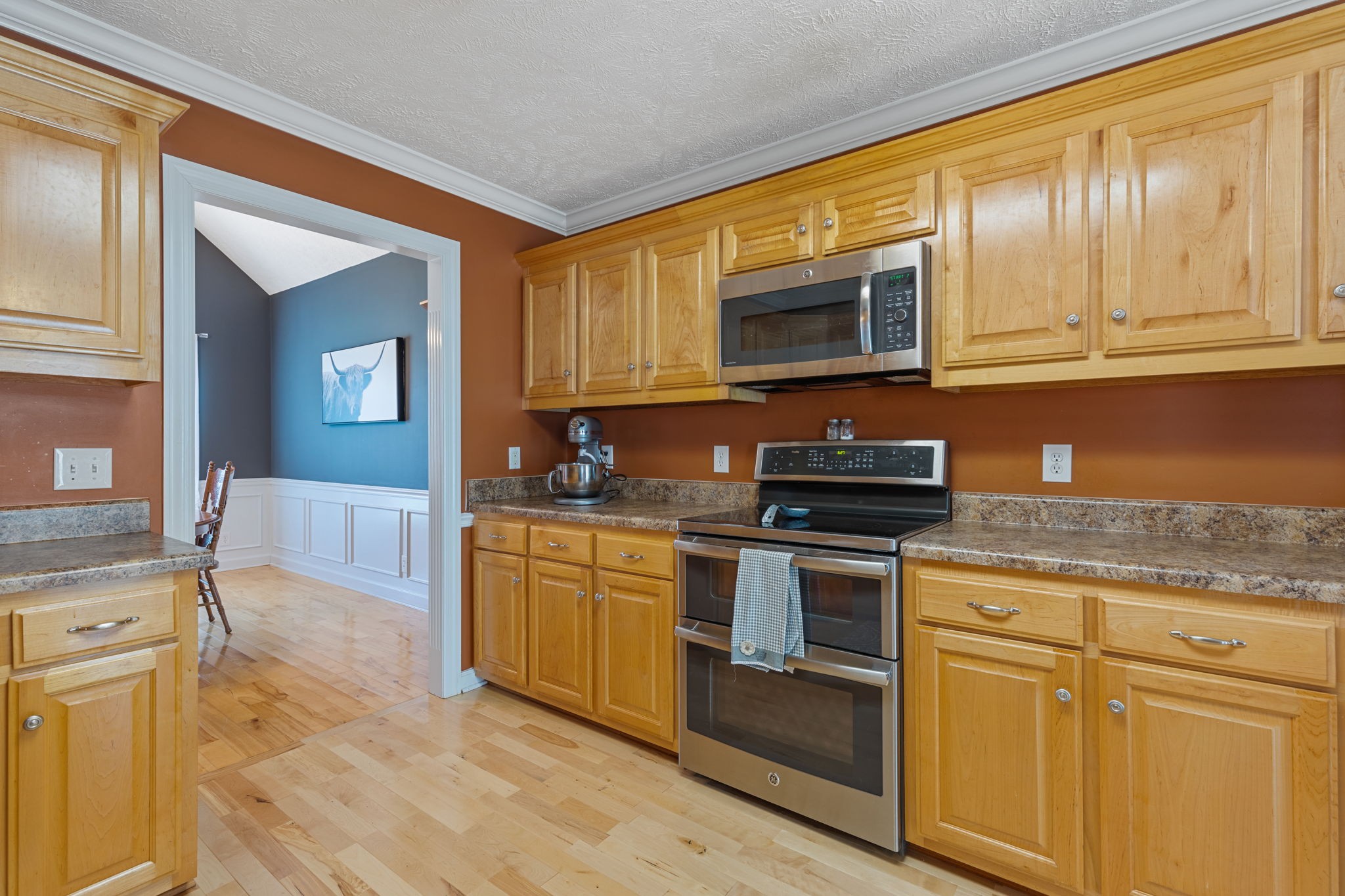 1972 Espy Road Bradyville, TN 37026 - Photo 15 of 67 a kitchen with stainless steel appliances granite countertop a stove a sink and a microwave