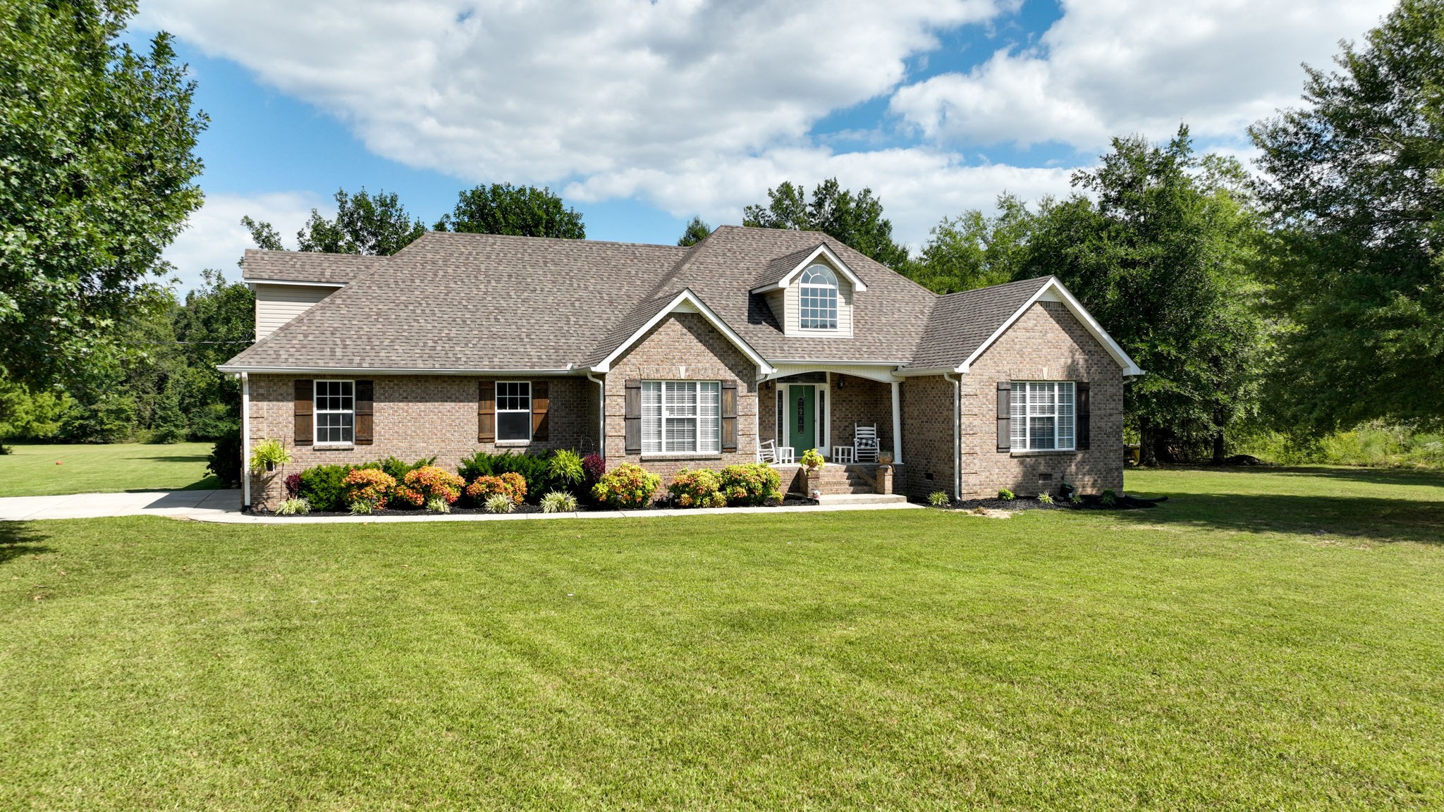 1972 Espy Road Bradyville, TN 37026 - Photo 2 of 67 a front view of a house with a garden