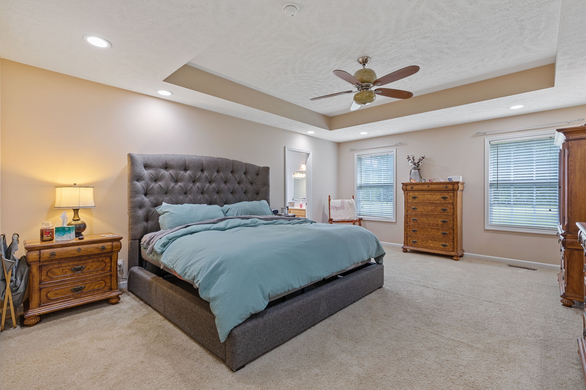 1972 Espy Road Bradyville, TN 37026 - Photo 21 of 67 a bedroom with a bed a dresser and a chandelier