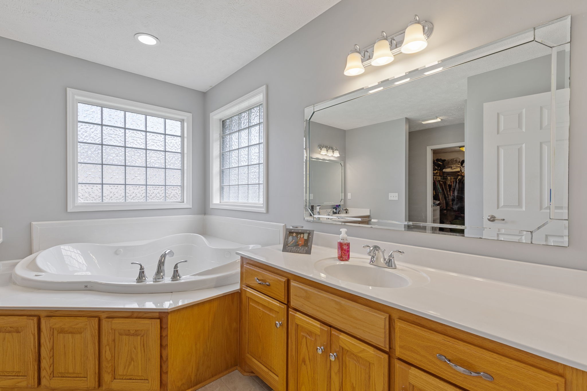 1972 Espy Road Bradyville, TN 37026 - Photo 25 of 67 a bathroom with a tub sink and mirror