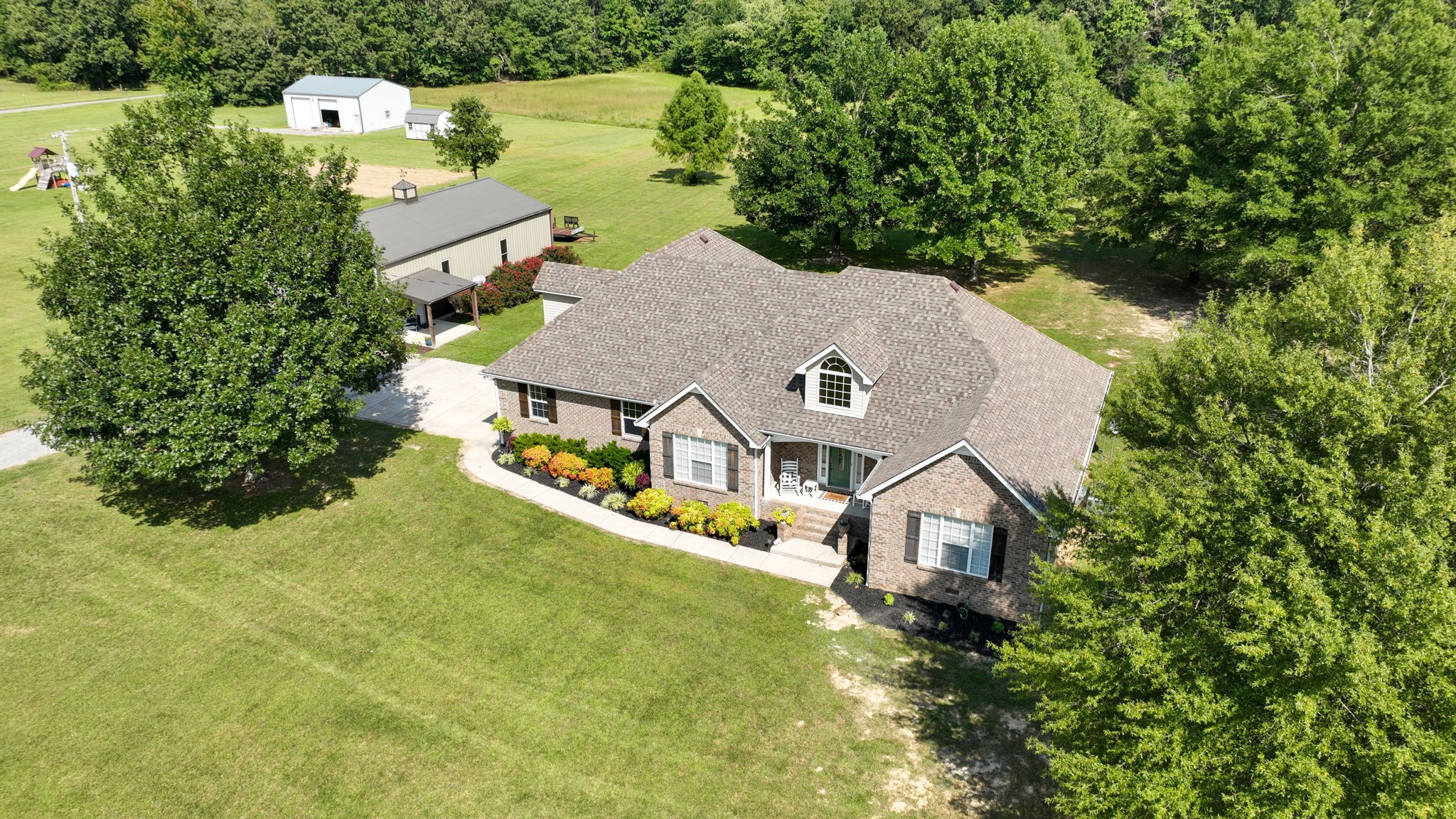 1972 Espy Road Bradyville, TN 37026 - Photo 4 of 67 an aerial view of a house with a yard basket ball court and outdoor seating