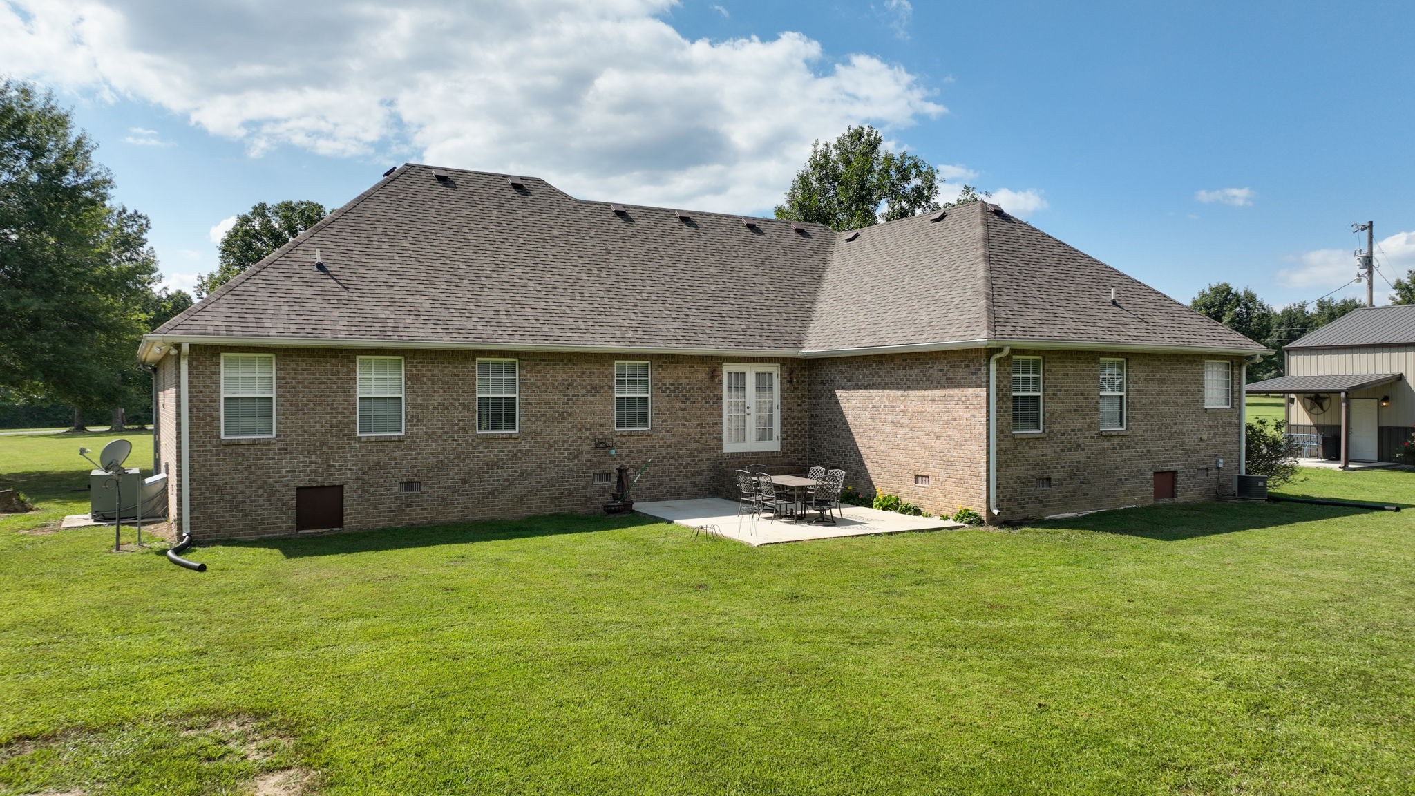 1972 Espy Road Bradyville, TN 37026 - Photo 48 of 67 a view of a house with a yard and sitting area