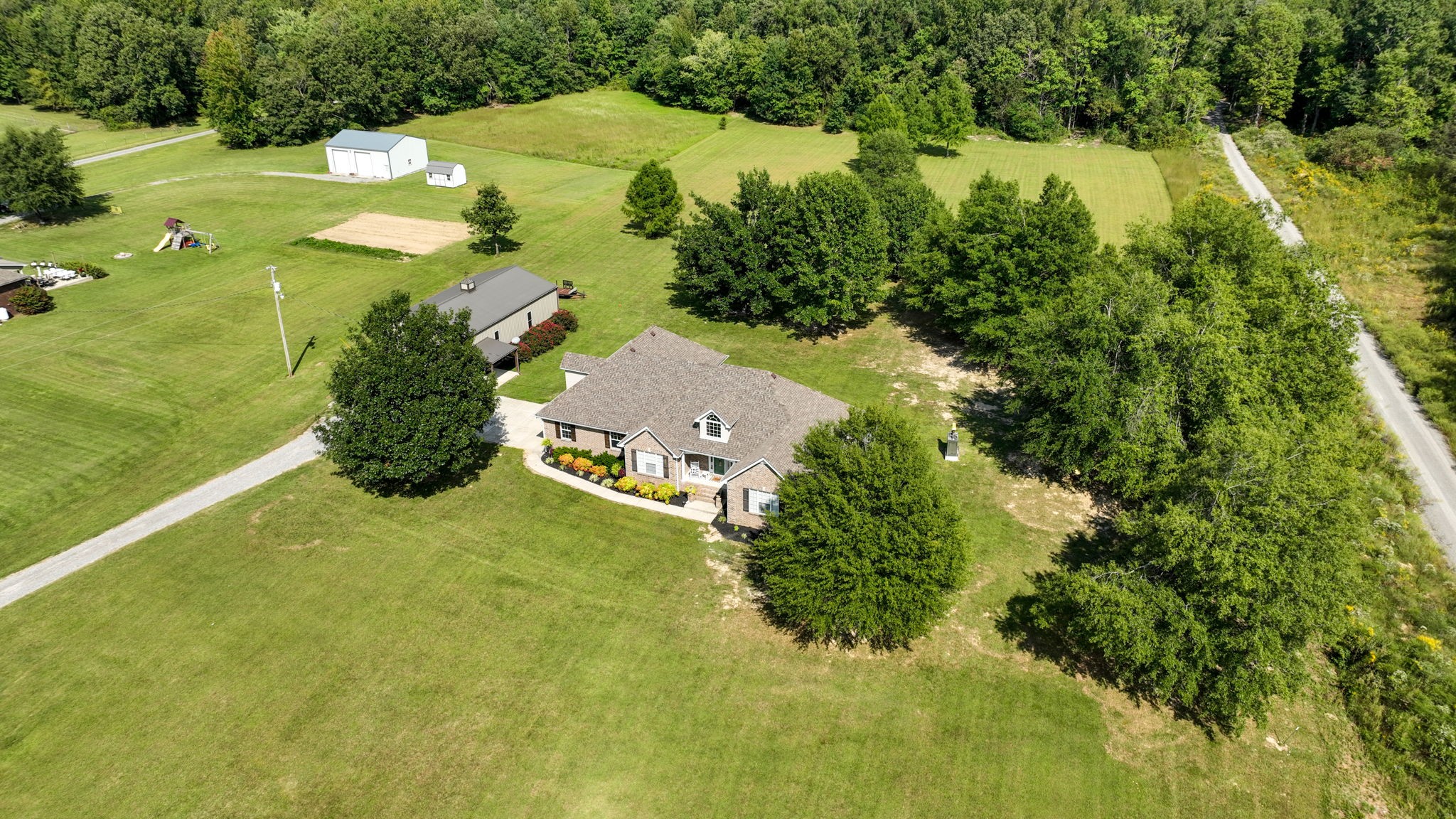 1972 Espy Road Bradyville, TN 37026 - Photo 61 of 67 an aerial view of residential houses with outdoor space and trees all around