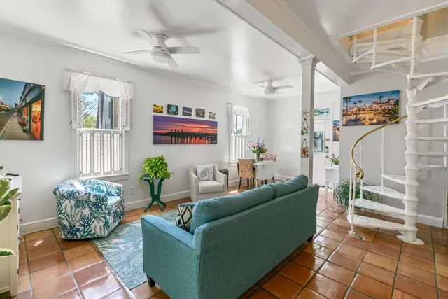 a living room with furniture and a rug