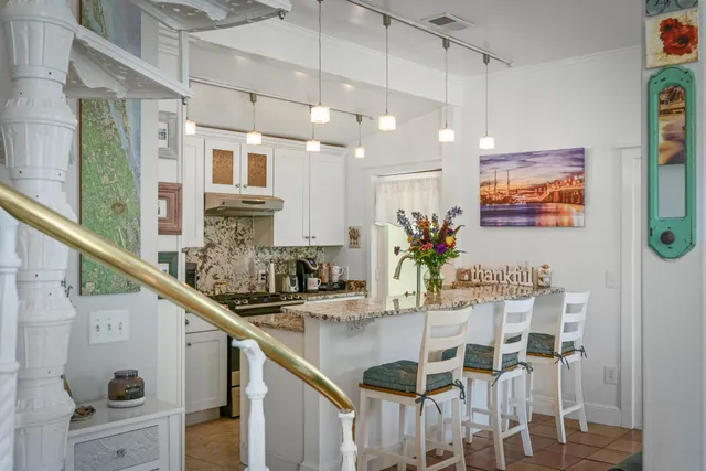 a kitchen with a dining table and chairs