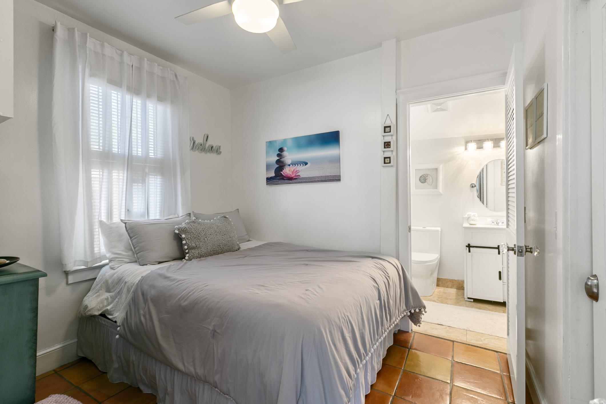 46 St Francis Street St. Augustine, FL 32084 - Photo 25 of 48 a bedroom with a bed and a window