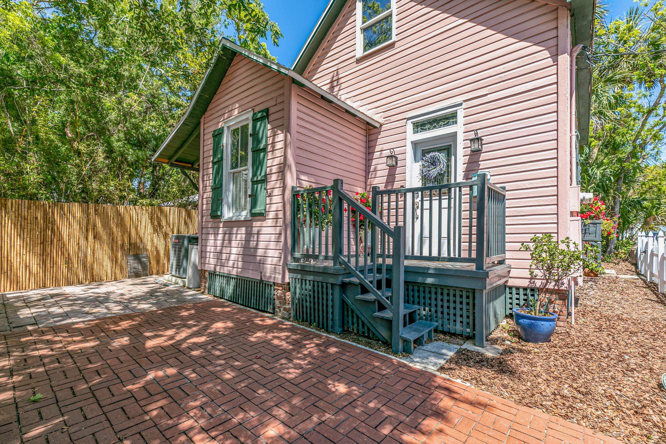 46 St Francis Street St. Augustine, FL 32084 - Photo 3 of 48 a front view of a house with garden
