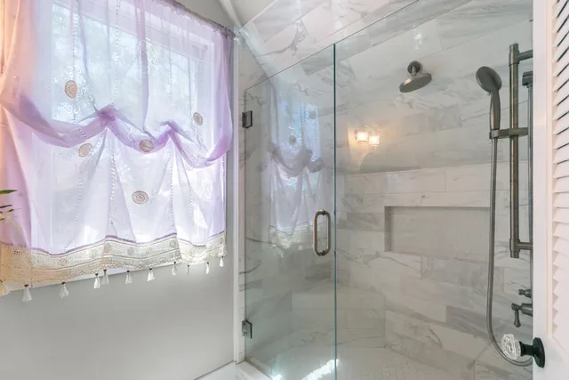 a bathroom with a sink vanity and mirror