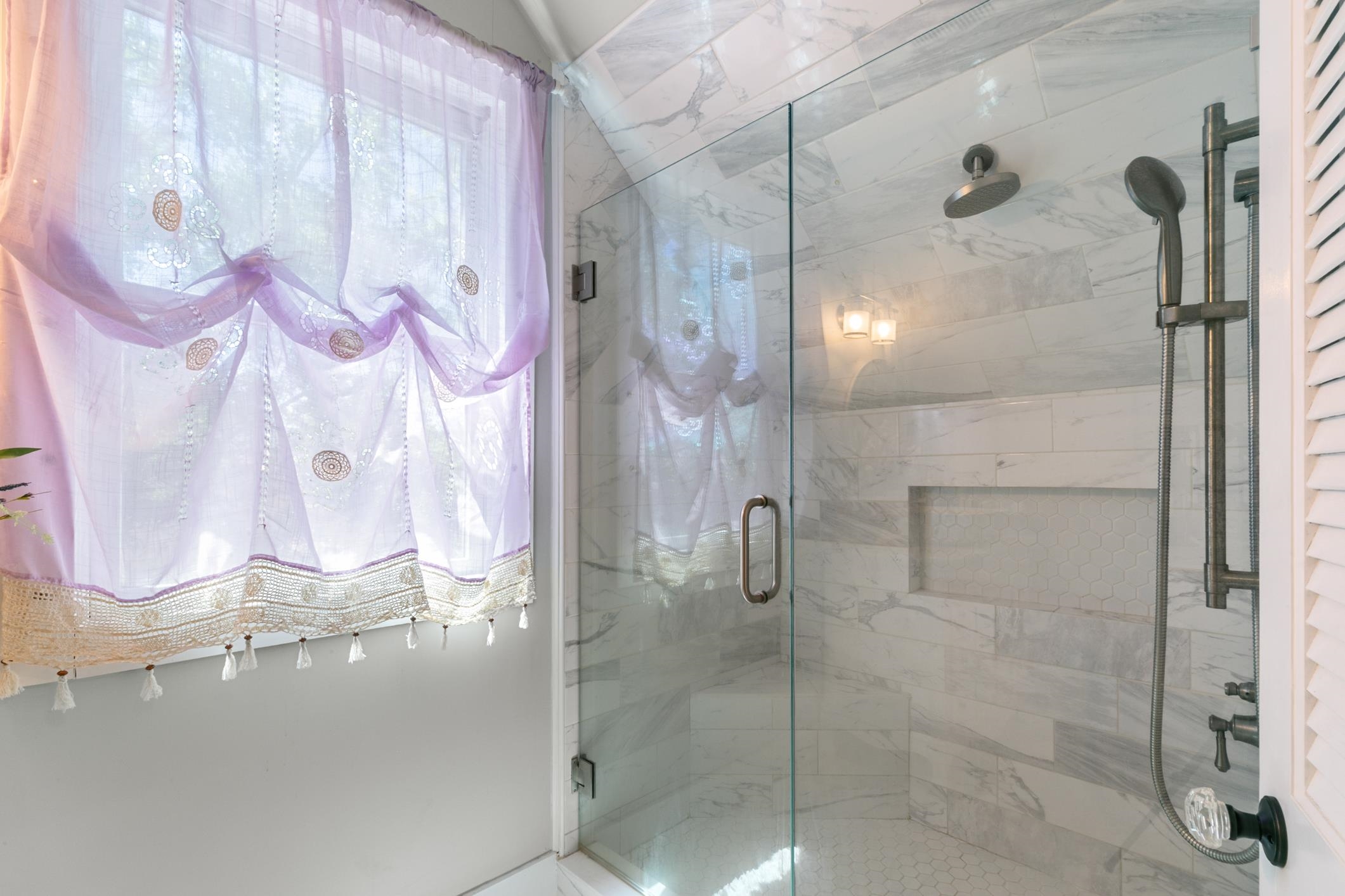 46 St Francis Street St. Augustine, FL 32084 - Photo 31 of 48 a bathroom with a glass shower door