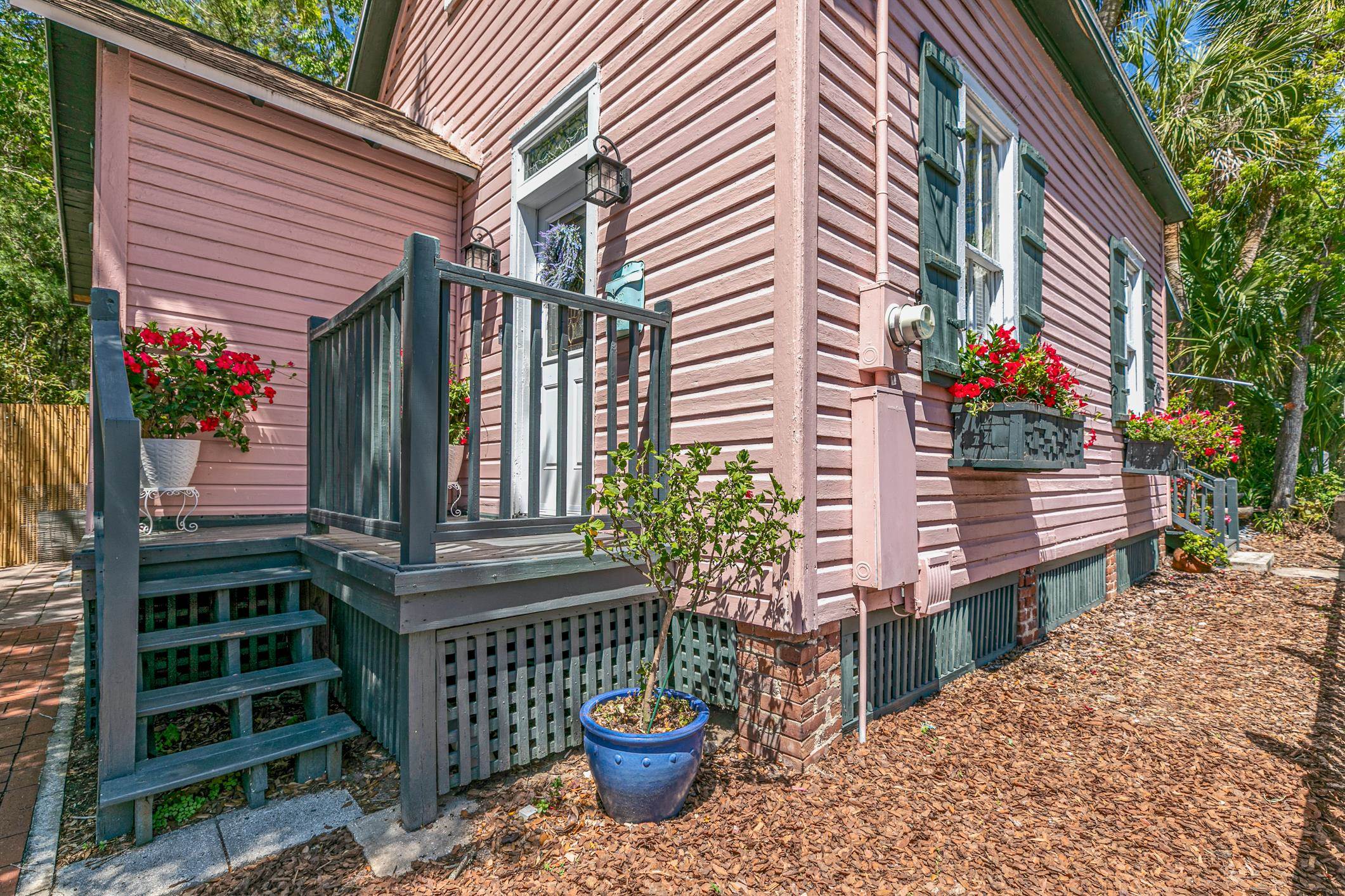 46 St Francis Street St. Augustine, FL 32084 - Photo 4 of 48 a front view of a house with a garden