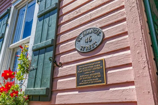 an aerial view of house with a yard and swimming pool