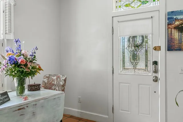 a bathroom with a potted plant