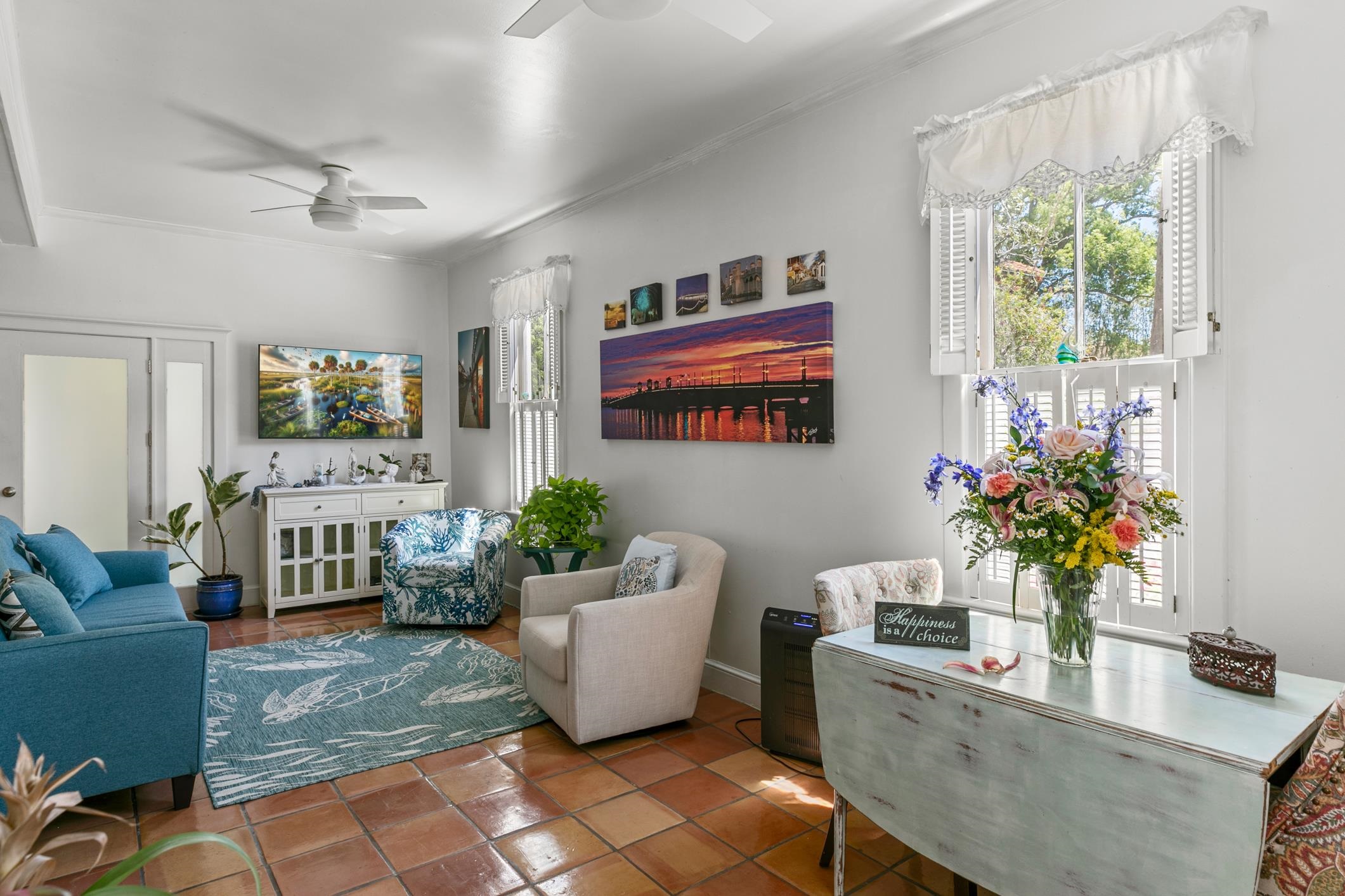 46 St Francis Street St. Augustine, FL 32084 - Photo 10 of 48 a living room with furniture and a potted plant