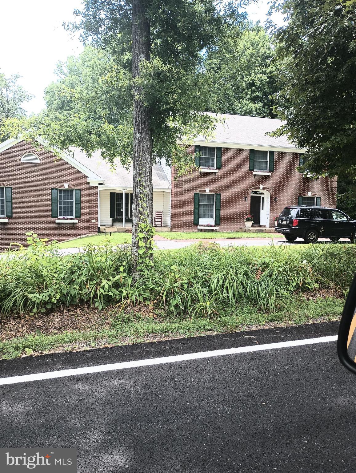 16501 Nottingham Road Upper Marlboro, MD 20772 - Photo 3 of 9 a front view of a house with a yard and potted plants