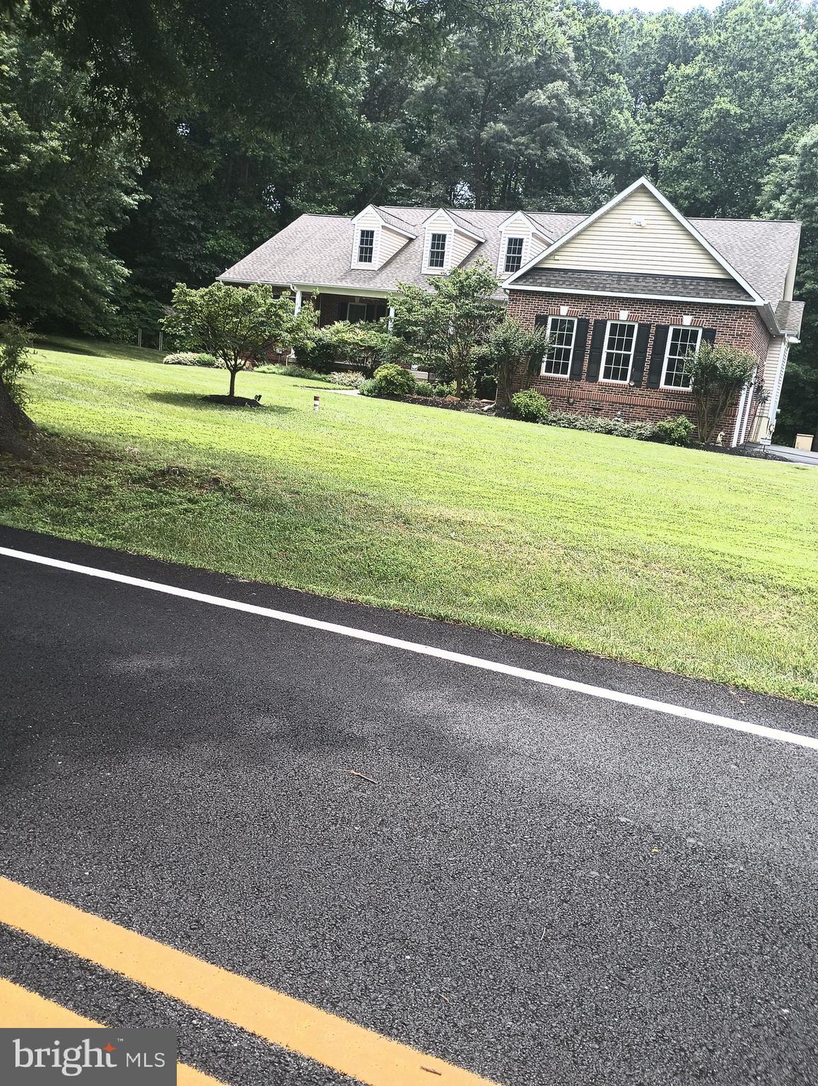 16501 Nottingham Road Upper Marlboro, MD 20772 - Photo 4 of 9 a view of an house with backyard and trees