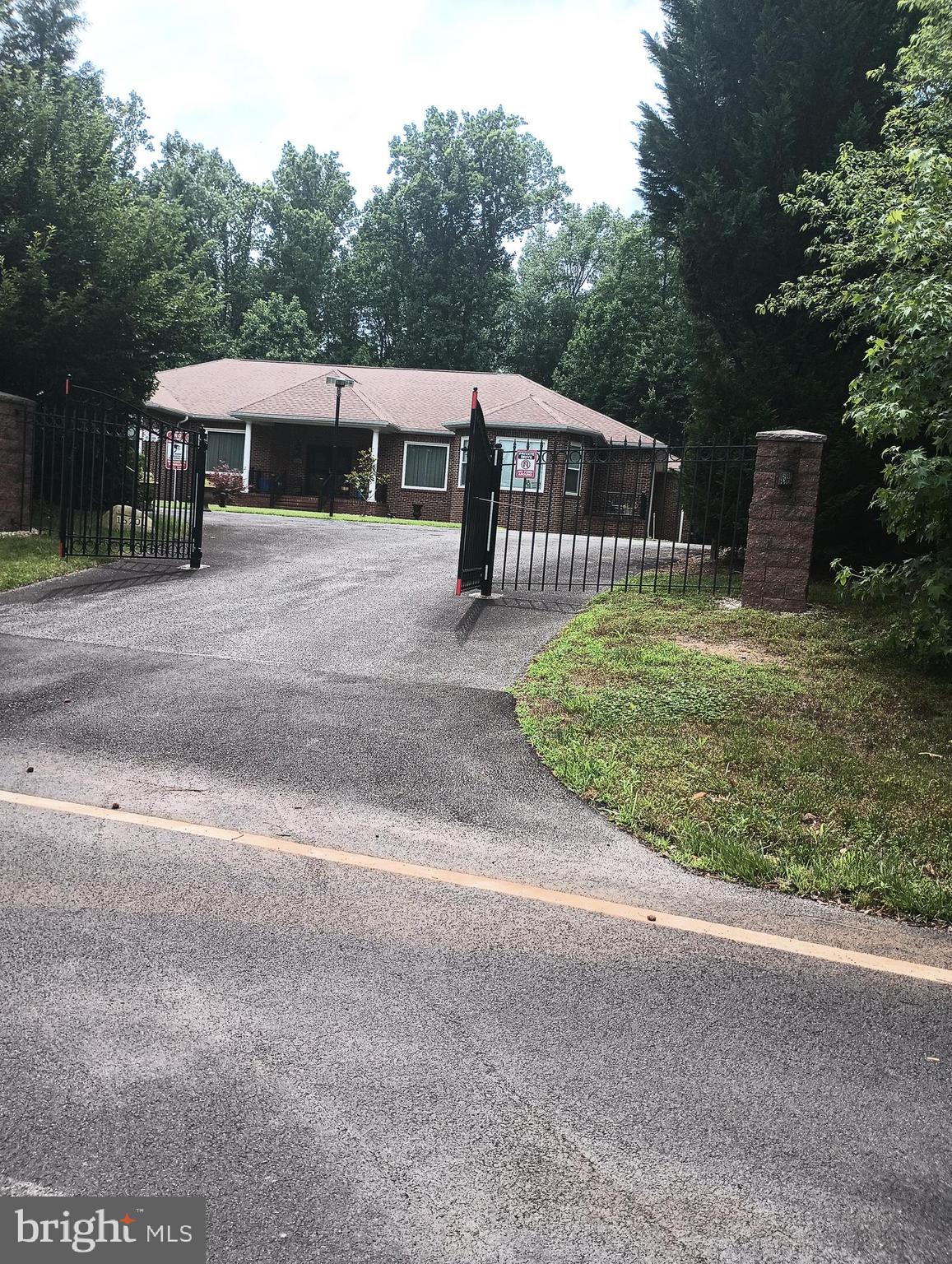 16501 Nottingham Road Upper Marlboro, MD 20772 - Photo 5 of 9 a front view of a house with a yard and a garage