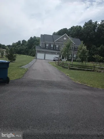 a view of street with houses in the background