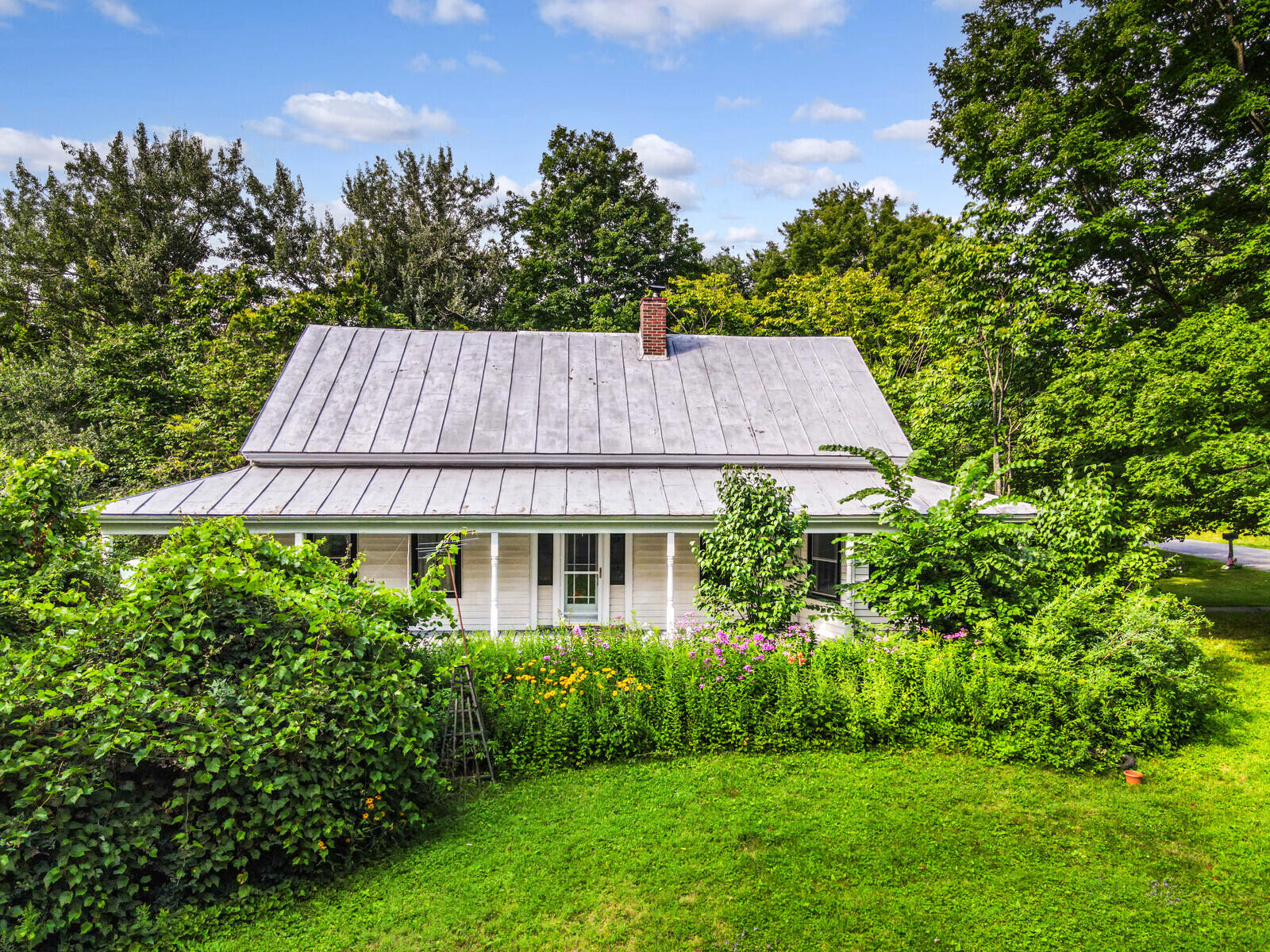 98 Burleigh Road Vassalboro, ME 04989 - Photo 55 of 59 Side porch garden/wild flowers