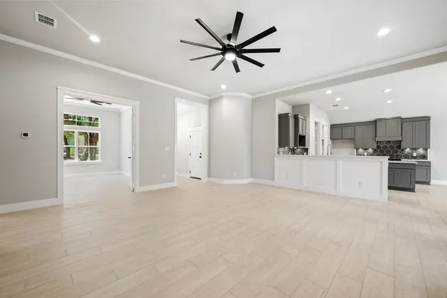 a view of a kitchen with a sink and cabinets