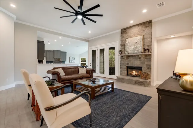 a living room with furniture and a fireplace