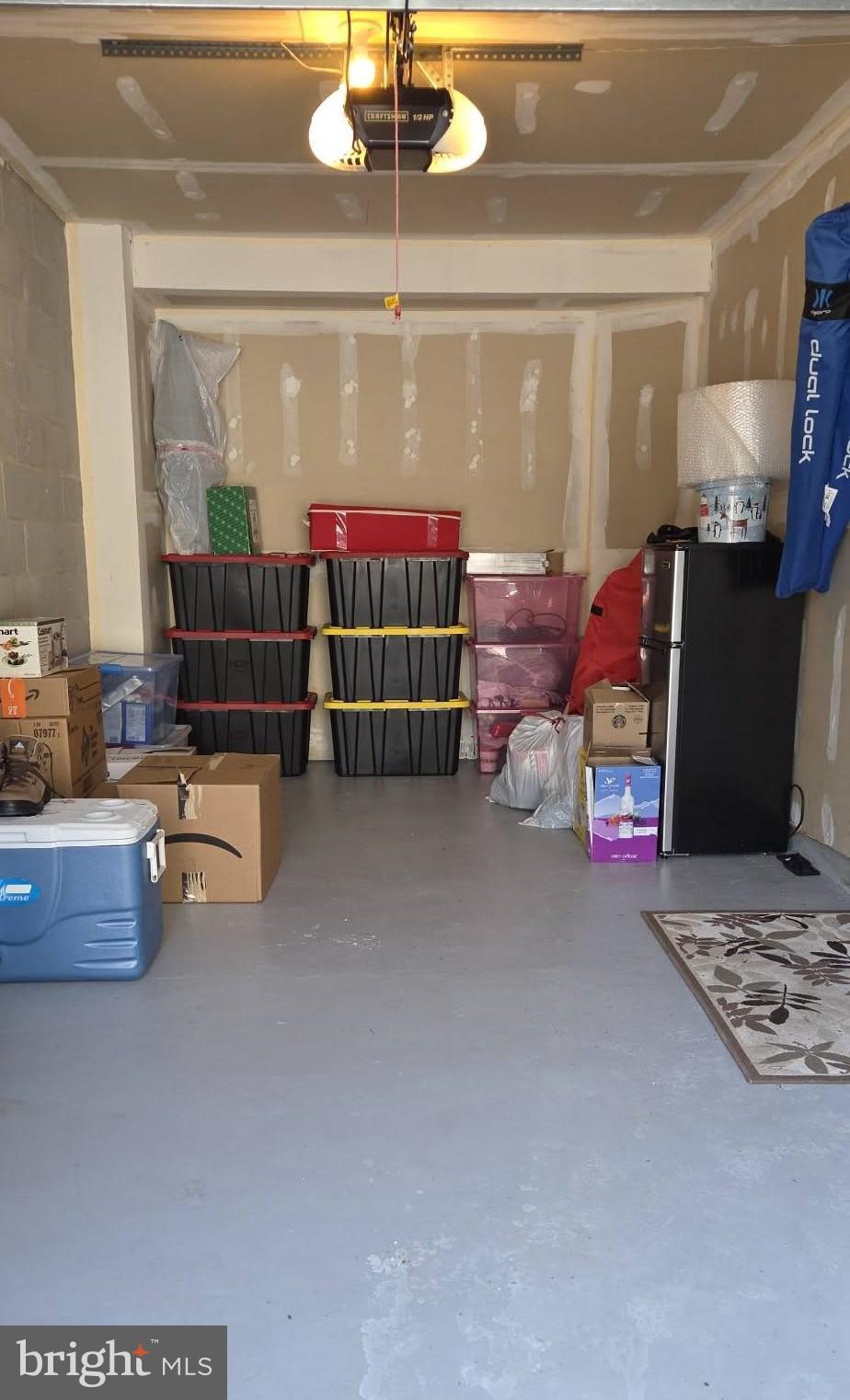 9729 Morningview Circle, Unit 9729 Perry Hall, MD 21128 - Photo 27 of 30 Single-car pad with remote and storage space.