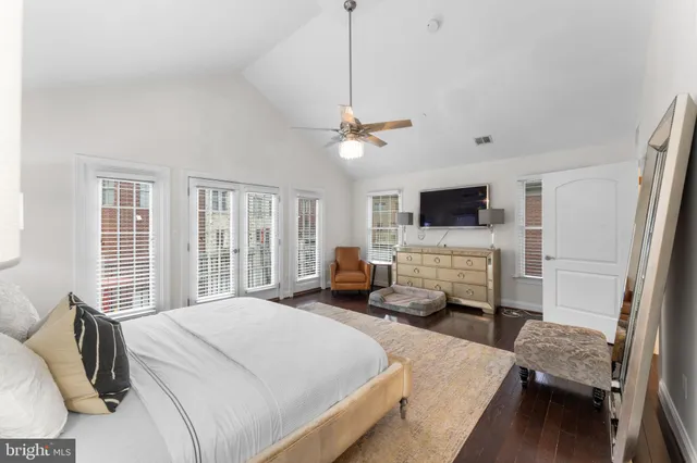 a bedroom with a bed and a couch