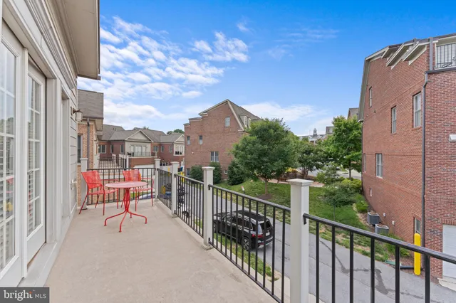 a view of hallway with wooden floor