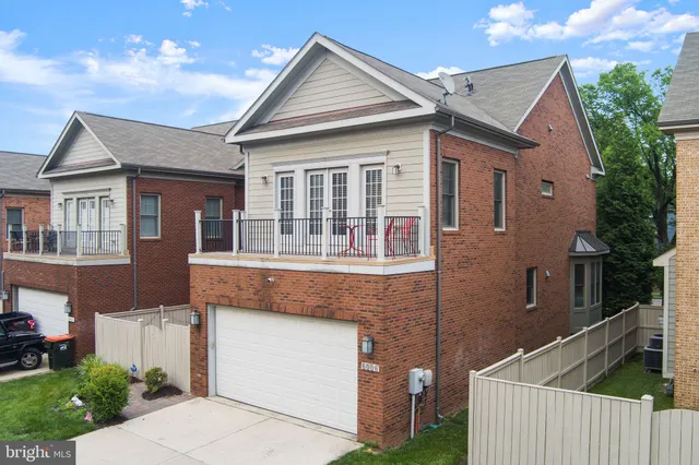 an aerial view of a house with outdoor space and street view