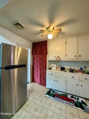 a bedroom with bed and a window