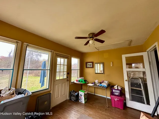 a bed room with furniture and windows