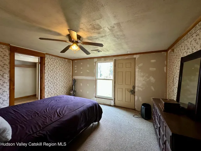 a living room with furniture couches and a flat screen tv