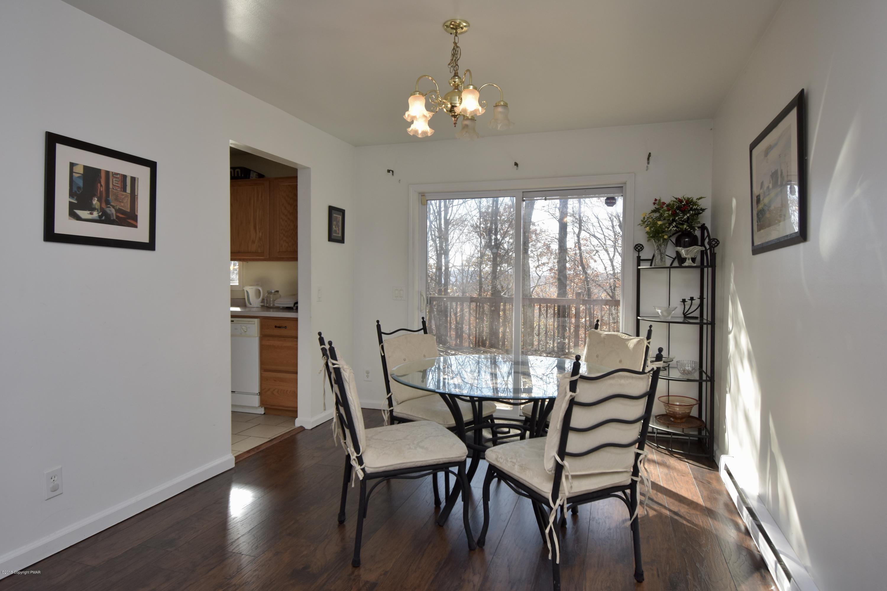 172 Edinburgh Road Bushkill, PA 18324 - Photo 6 of 26 a view of a dining room with furniture window and outside view