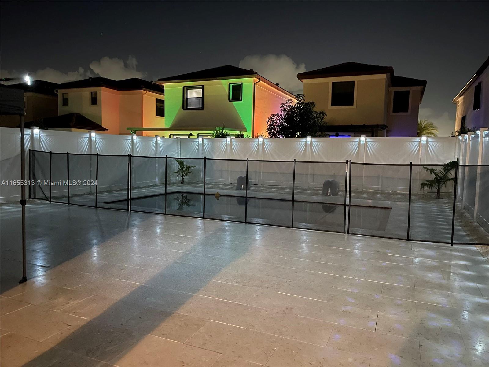 11015 West 35th Way Hialeah, FL 33018 - Photo 5 of 5 a view of a brick house with many windows