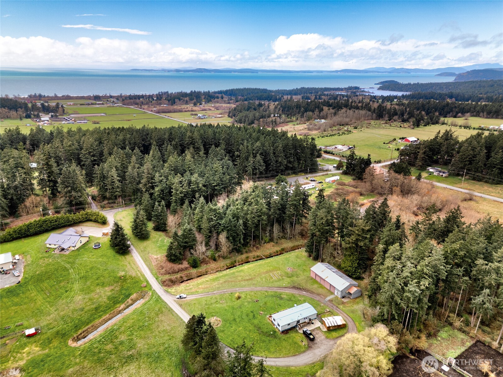 4540 Monkey Hill Road Oak Harbor, WA 98277 - Photo 1 of 36 a view of a lake with a mountain
