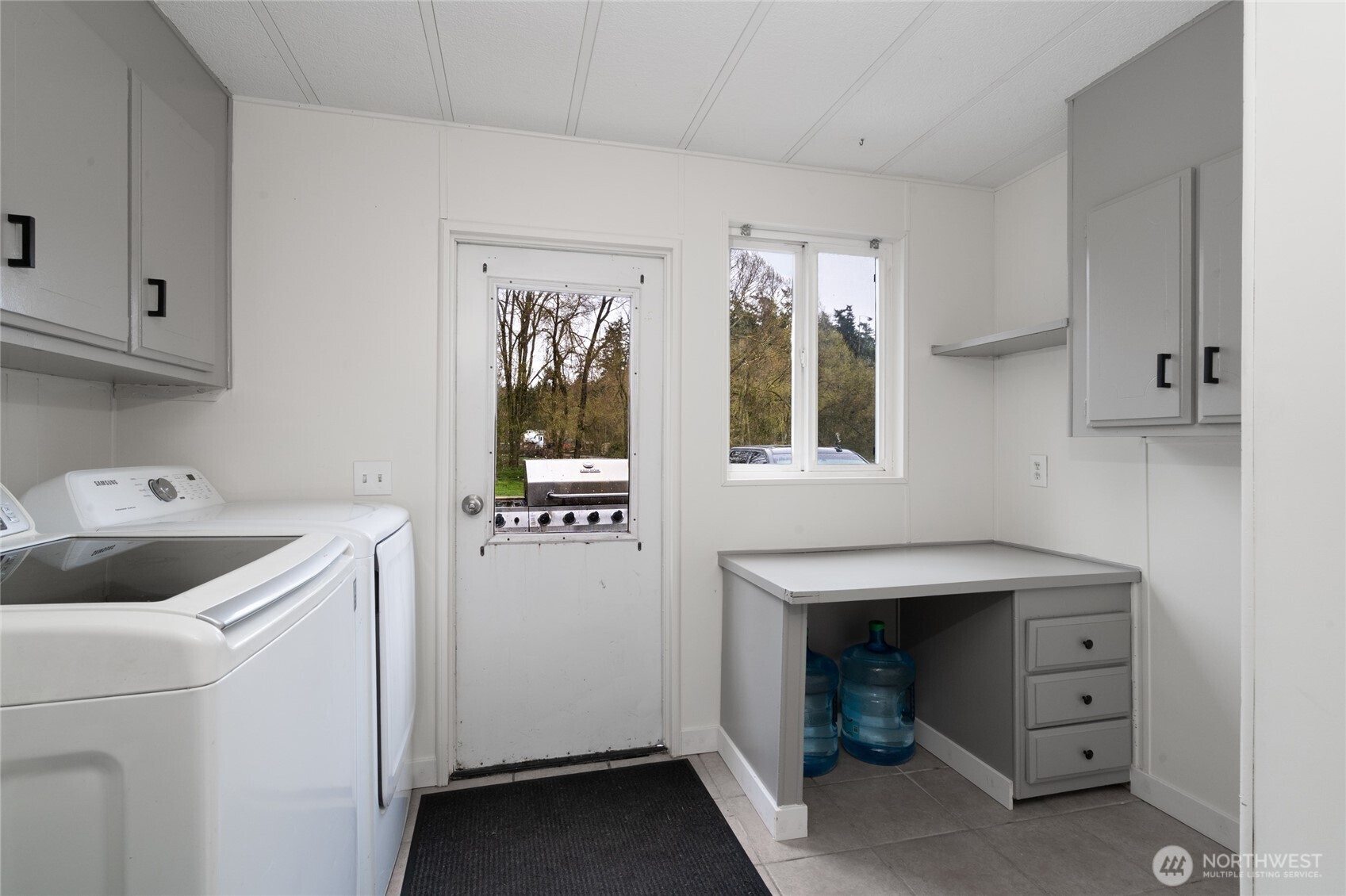 4540 Monkey Hill Road Oak Harbor, WA 98277 - Photo 25 of 36 a room with cabinets and washer