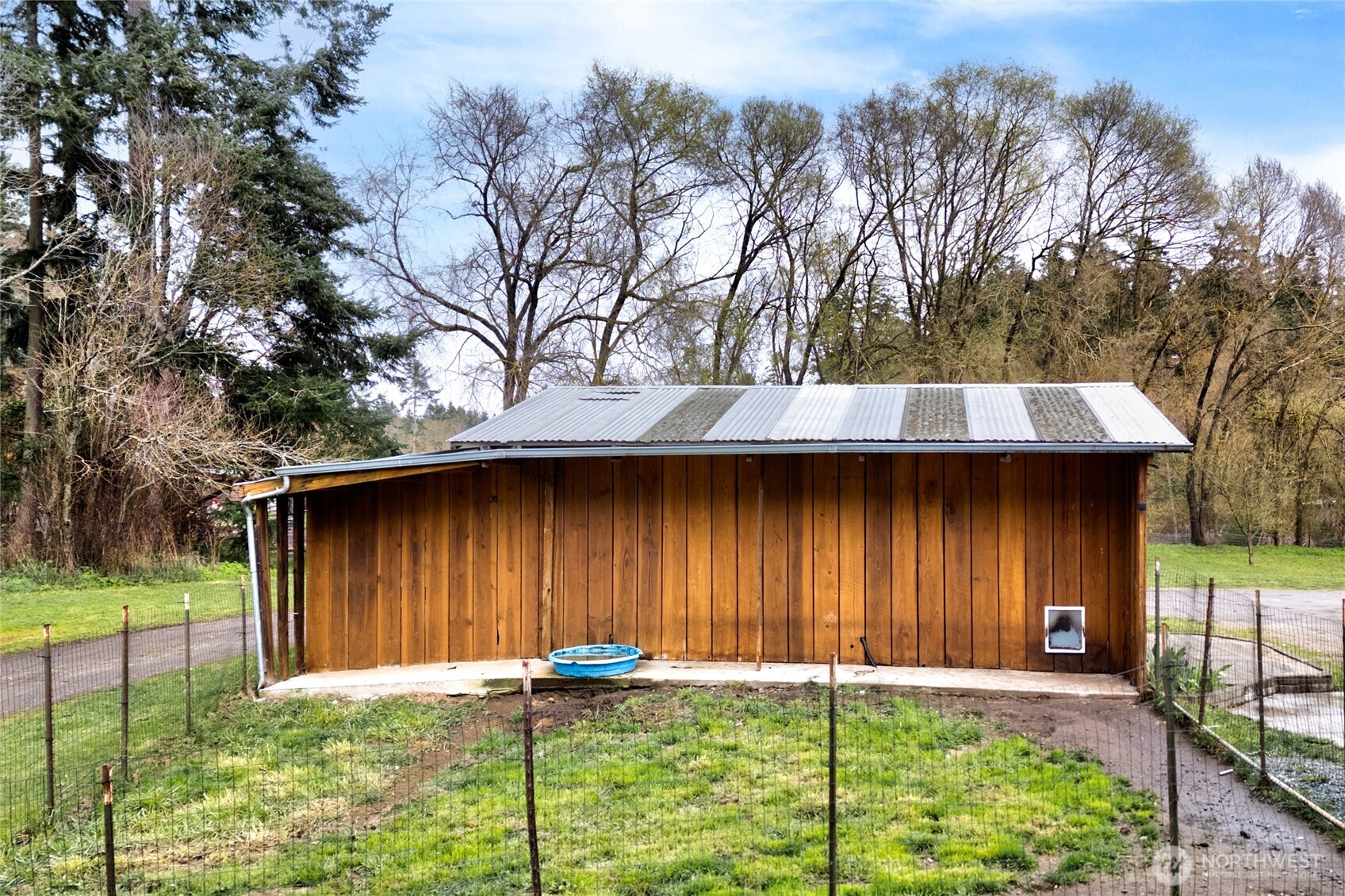 4540 Monkey Hill Road Oak Harbor, WA 98277 - Photo 32 of 36 a backyard of a house with table and chairs
