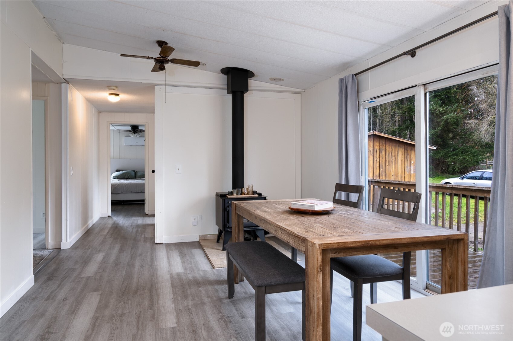 4540 Monkey Hill Road Oak Harbor, WA 98277 - Photo 7 of 36 a view of a dining room with furniture window and wooden floor