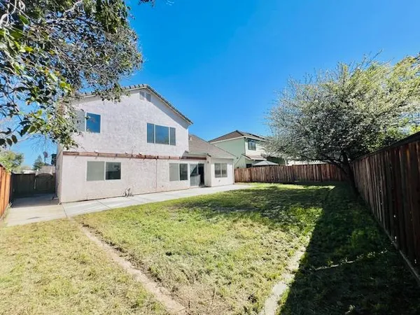 a house that has tree in front of it