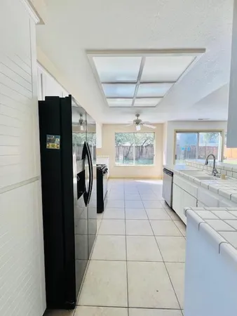 a kitchen with stainless steel appliances a refrigerator and a sink