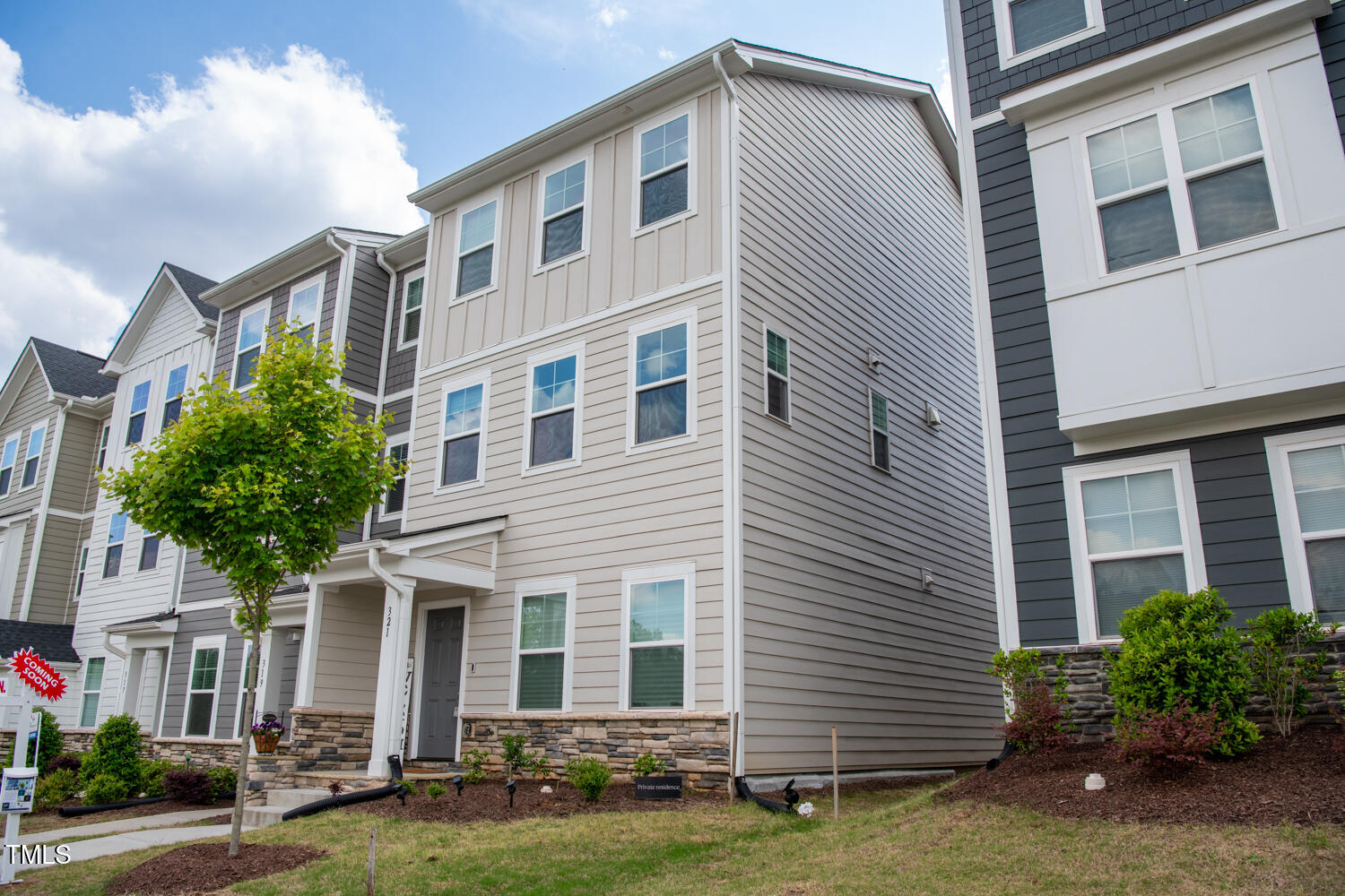 a front view of a house with a yard
