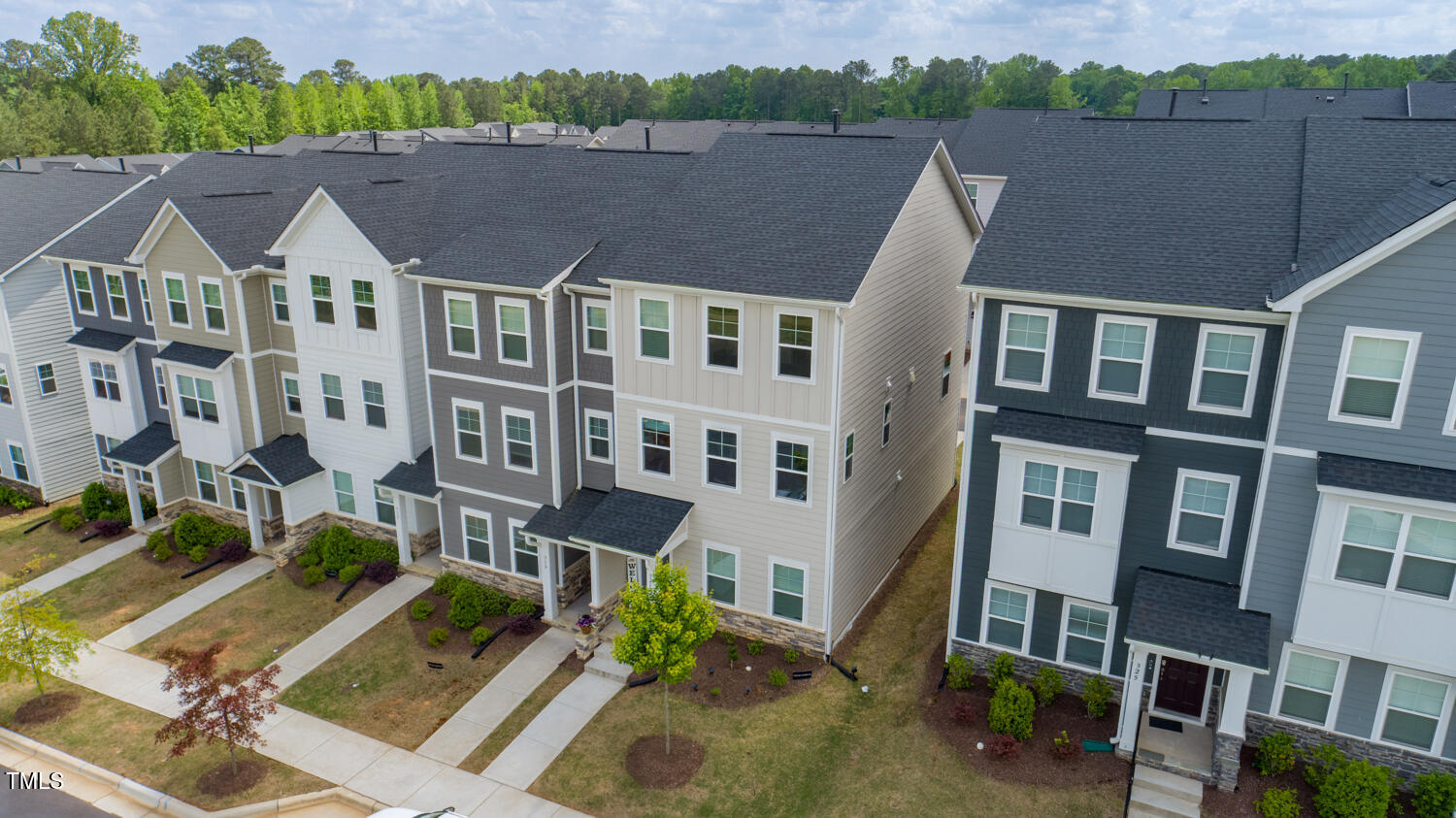 321 Devon Cliffs Drive Wake Forest, NC 27587 - Photo 23 of 26 a view of multiple houses with a lake view