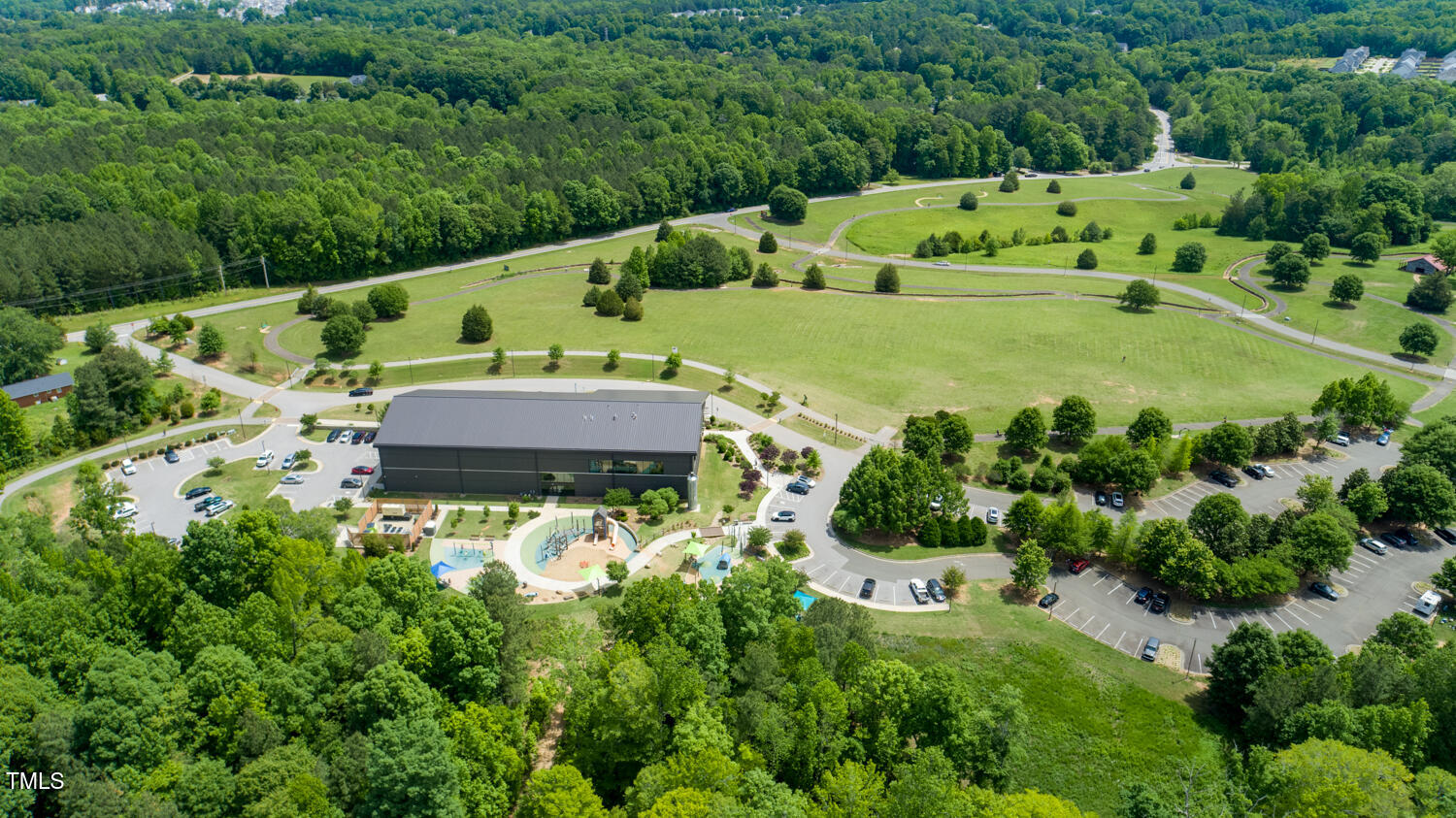 321 Devon Cliffs Drive Wake Forest, NC 27587 - Photo 24 of 26 an aerial view of house with yard swimming pool and outdoor seating