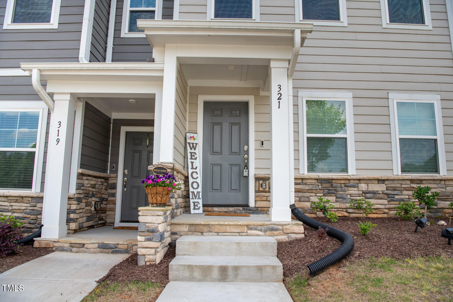 321 Devon Cliffs Drive Wake Forest, NC 27587 - Photo 2 of 26 a front view of a house