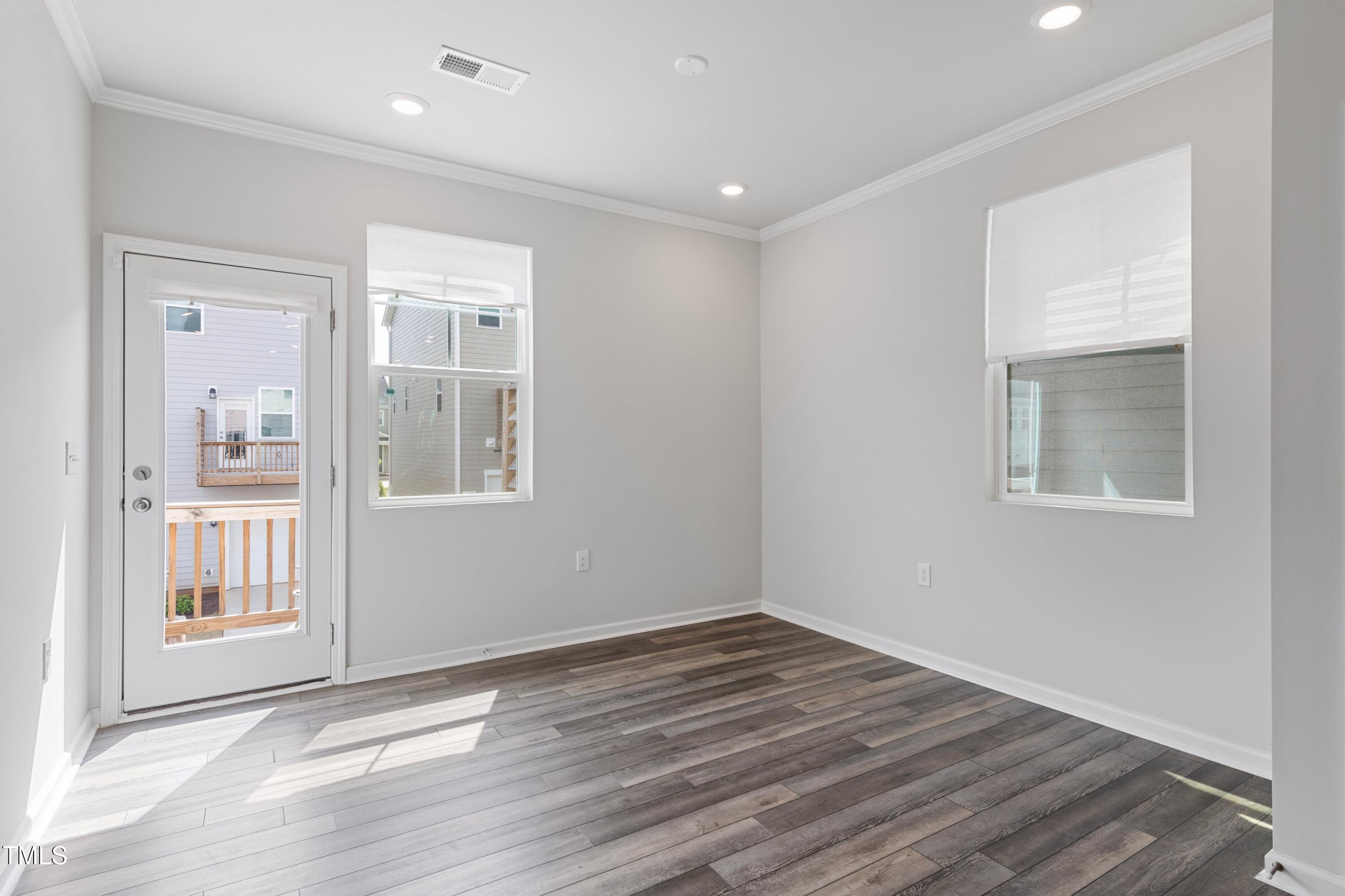 321 Devon Cliffs Drive Wake Forest, NC 27587 - Photo 6 of 26 a view of empty room with wooden floor