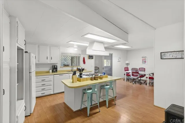 a very nice looking kitchen with a table and chairs